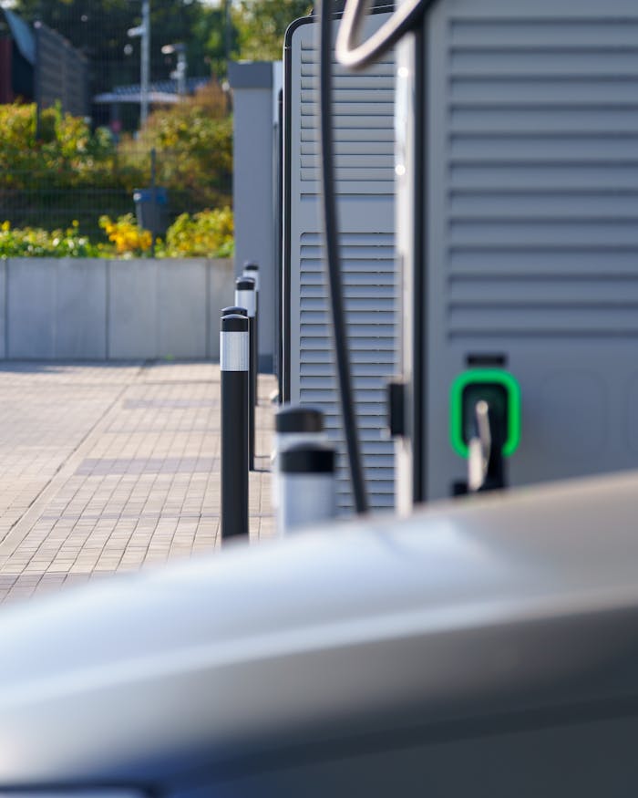 Modern electric vehicle charging station outdoors highlighting clean transport and sustainable energy.